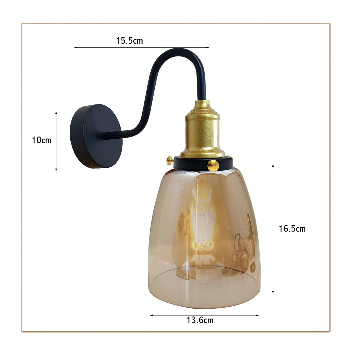 Close-up of the Whitechapel wall sconce's amber glass shade and brass gooseneck arm, highlighting craftsmanship and finish de
