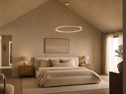 Aurelia LED ring chandelier above linen-upholstered bed in vaulted master bedroom