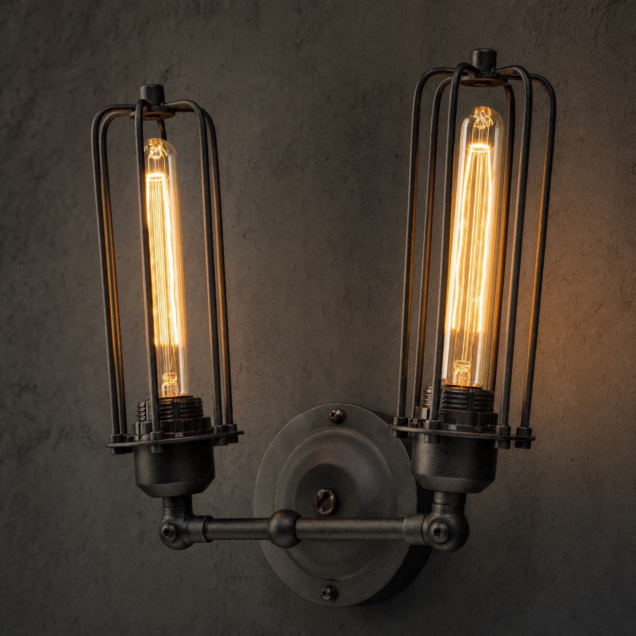 Clerkenwell wall sconce close-up detail showing matte black iron cage construction and T30 Edison filament bulbs