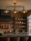 Limehouse 3-light copper pipe ceiling bar installed in an industrial warehouse kitchen