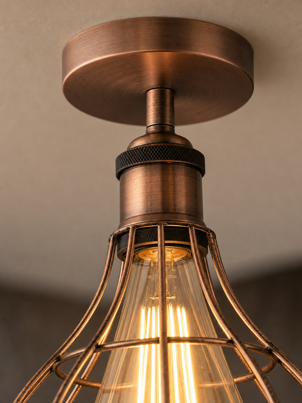 Close-up detail of the Bethnal Green copper wireframe cage and knurled bronze bulb holder