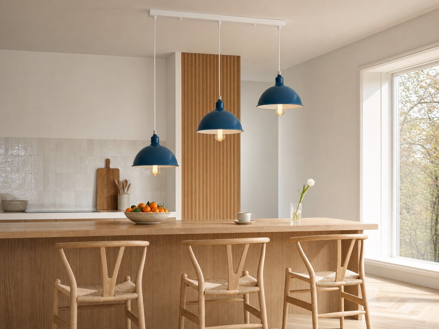 Shoreditch 3-light industrial dome bar pendant in petrol blue over a pale oak Scandinavian breakfast bar with wishbone bar stools and fluted oak panelling